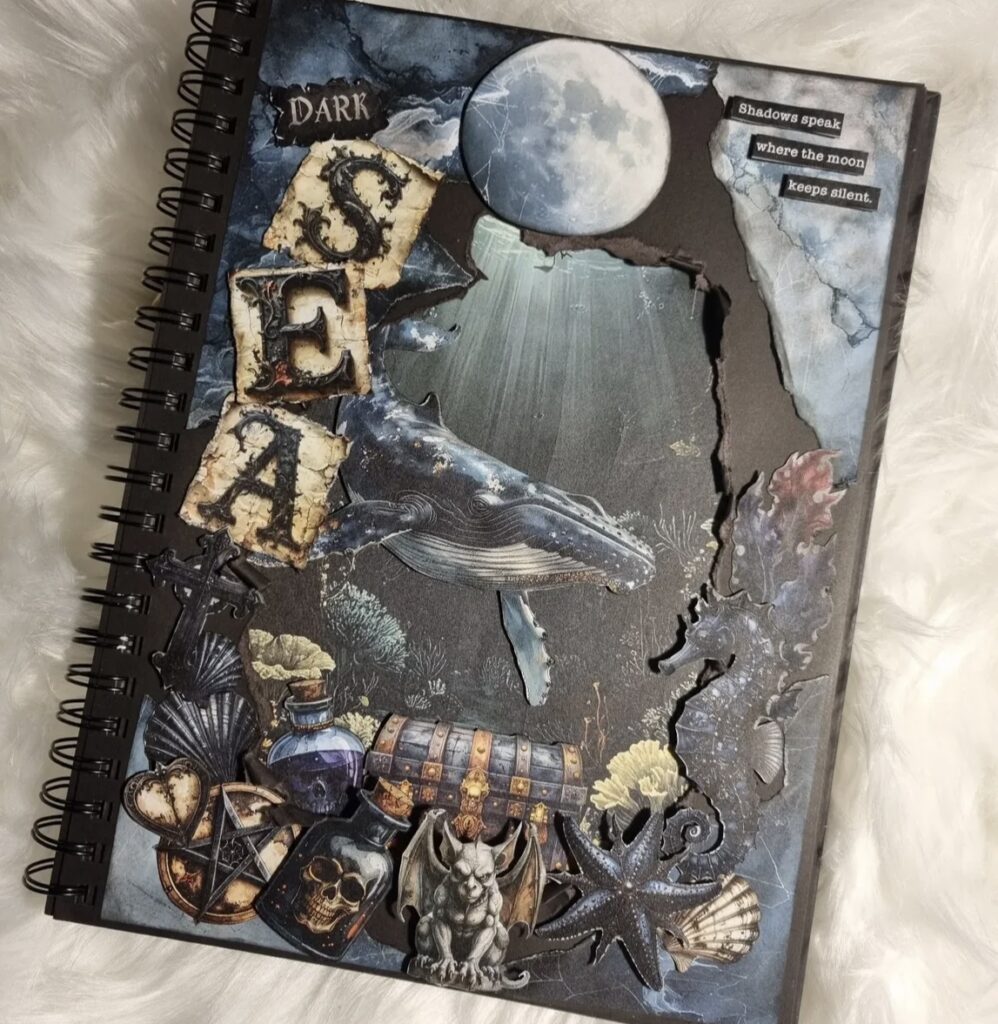 Dark ocean junk journal cover with “SEA” letters, moon, whale, seahorse, treasure chest, shells, and underwater collage elements.