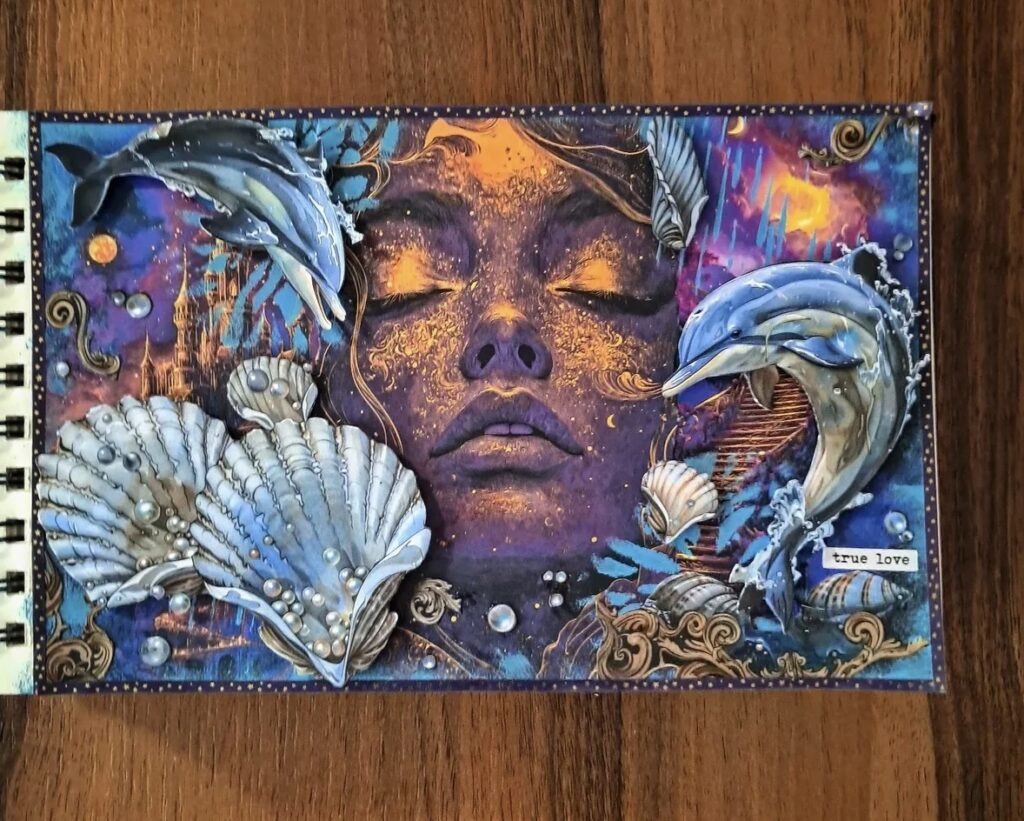 Ocean themed collage art with a dreamy face, dolphins, shells, pearls, and underwater details, plus the phrase “true love.”