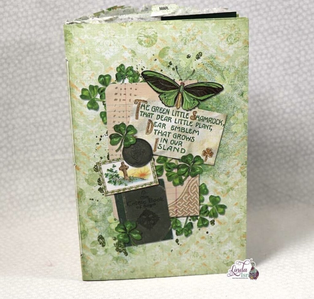 Handmade green scrapbook cover with a large butterfly, Celtic designs, and the phrase “The green little shamrock, that dear little plant.