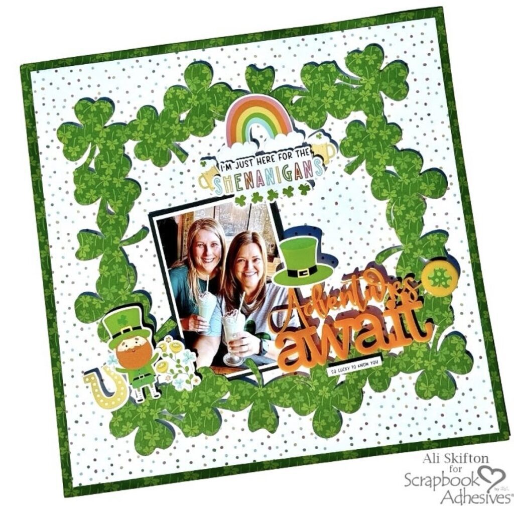 St. Patrick’s Day scrapbook layout with a shamrock wreath frame, photo in the center, leprechaun and rainbow accents, and “I’m just here for the shenanigans” title.