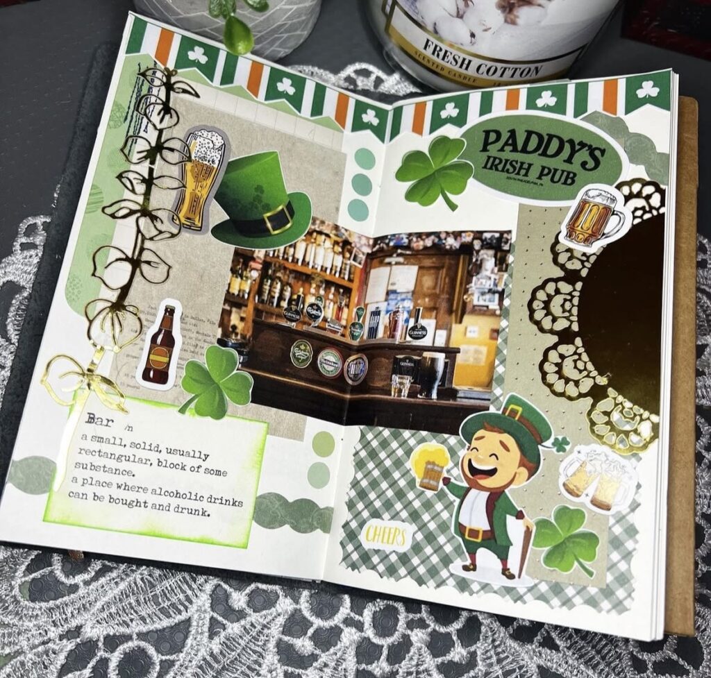 St. Patrick’s Day journal spread inspired by Irish pubs, decorated with beer mugs, clovers, a leprechaun sticker, and a photo of a cozy pub interior.