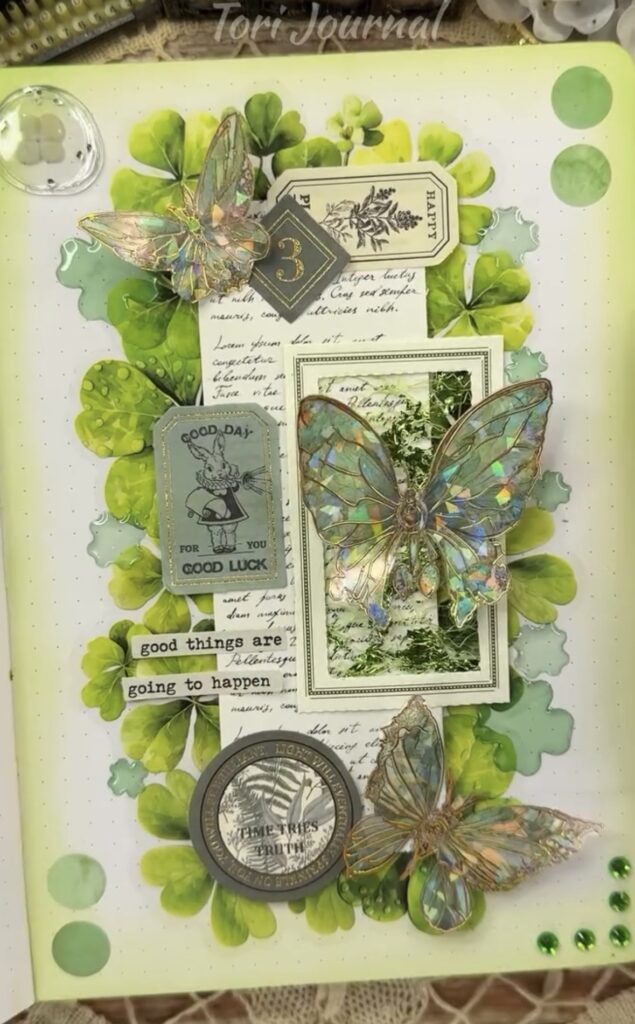 Layered green junk journal spread with transparent butterflies, shamrock leaves, vintage tickets, and the phrase “Good things are going to happen.”