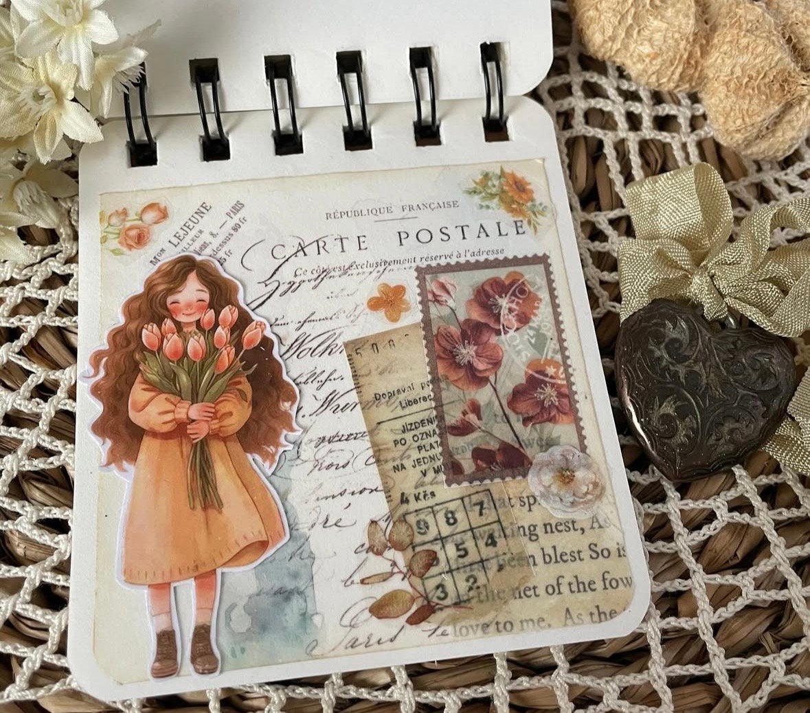 Spring scrapbook page featuring a post card look with a sticker of a girl holding a bunch of tulip flowers