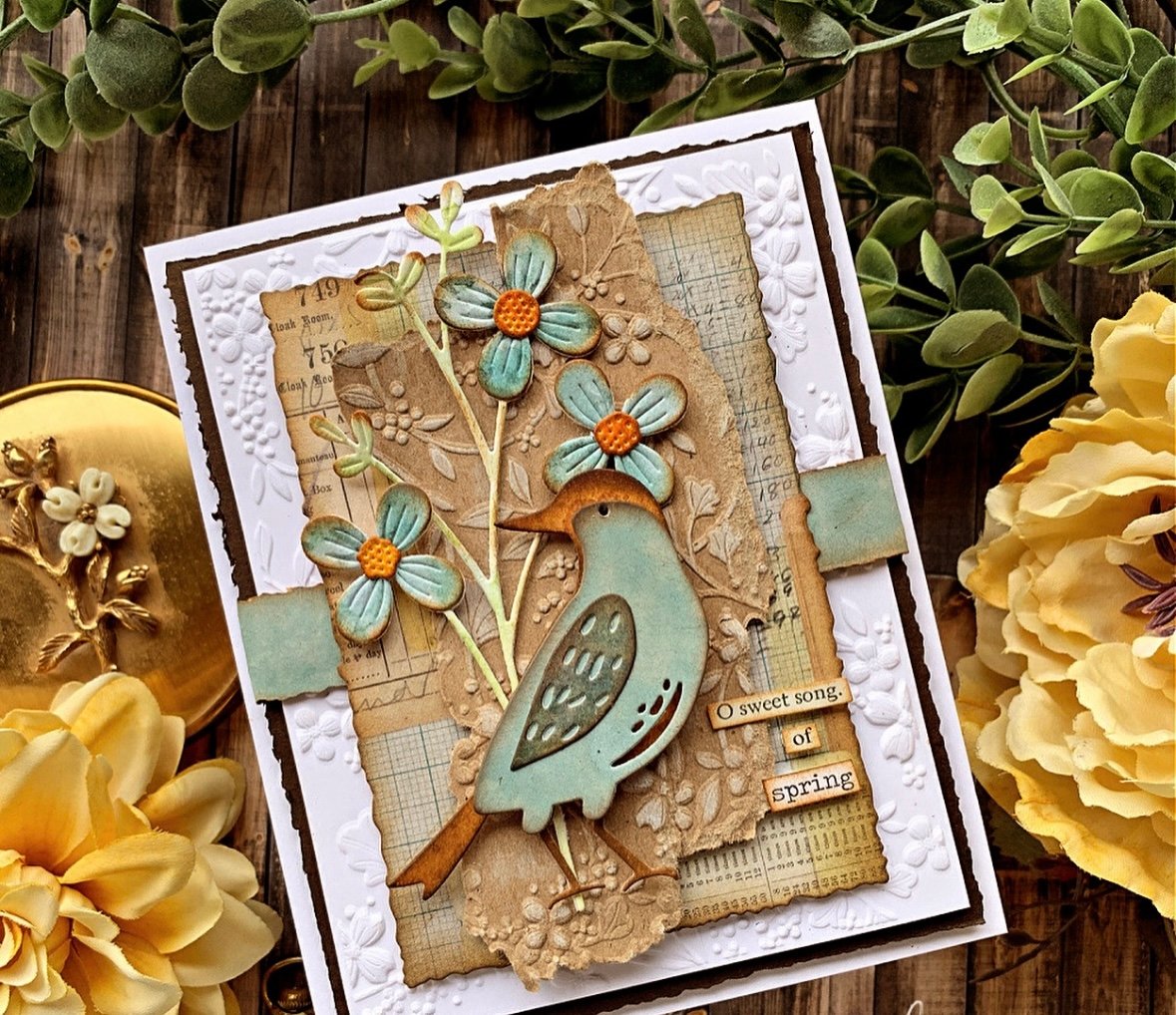 Spring scrapbook card featuring a bird and flowers over tan background