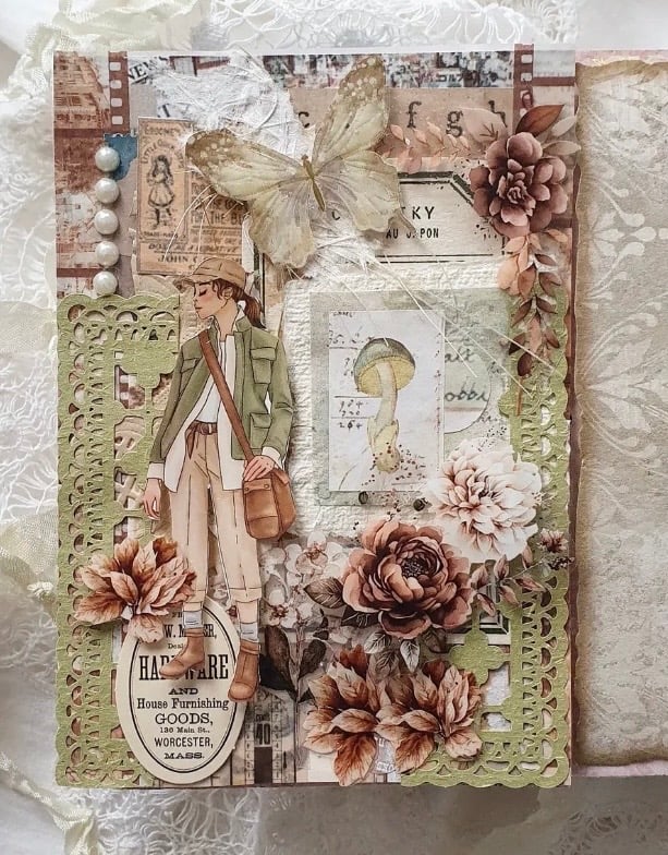 Subtle St. Patrick’s Day scrapbook page in soft neutral and sage green tones, featuring a vintage traveler illustration, layered ephemera, lace textures, a translucent butterfly, and muted floral embellishments.