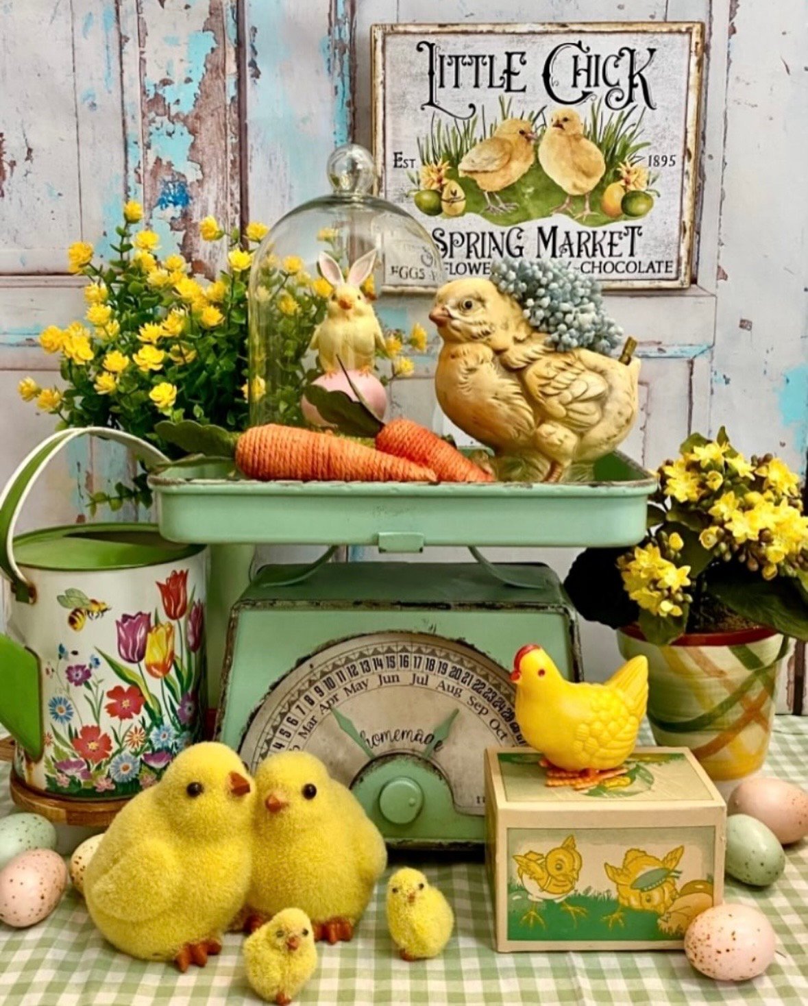 vintage scale used as a tiered tray for easter decor with yellow chicks, carrots and yellow flowers