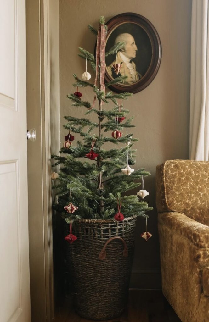 Unusually decorated Christmas tree with simple and sparce ornaments and festive seasonal decor