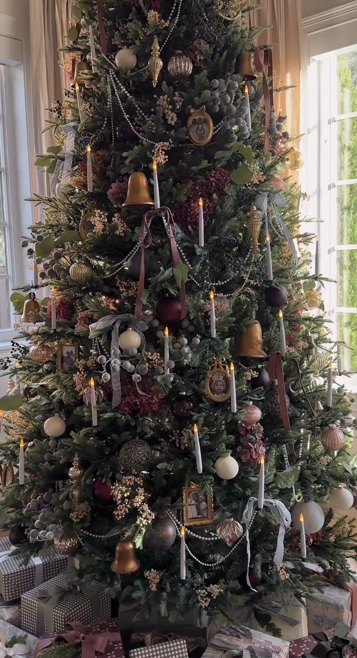 Victorian-inspired Christmas tree with rich brown decorations and dramatic vintage holiday styling