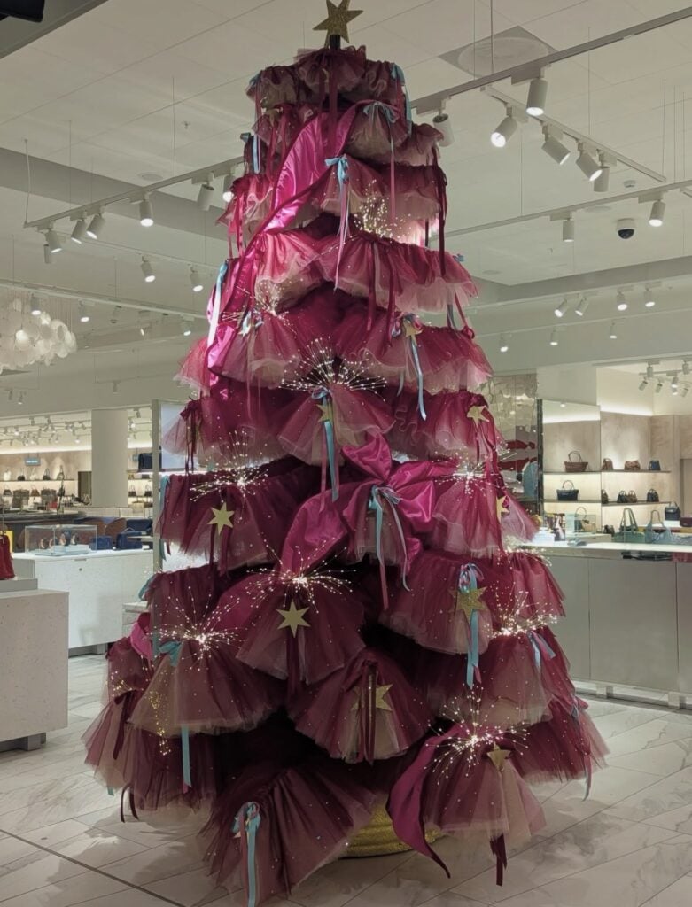 Artistic alternative Christmas tree with modern shape and festive decorations