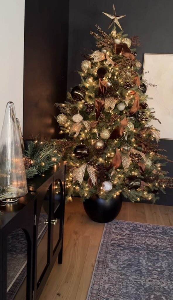 Christmas tree styled with layered brown ornaments and cozy natural holiday accents