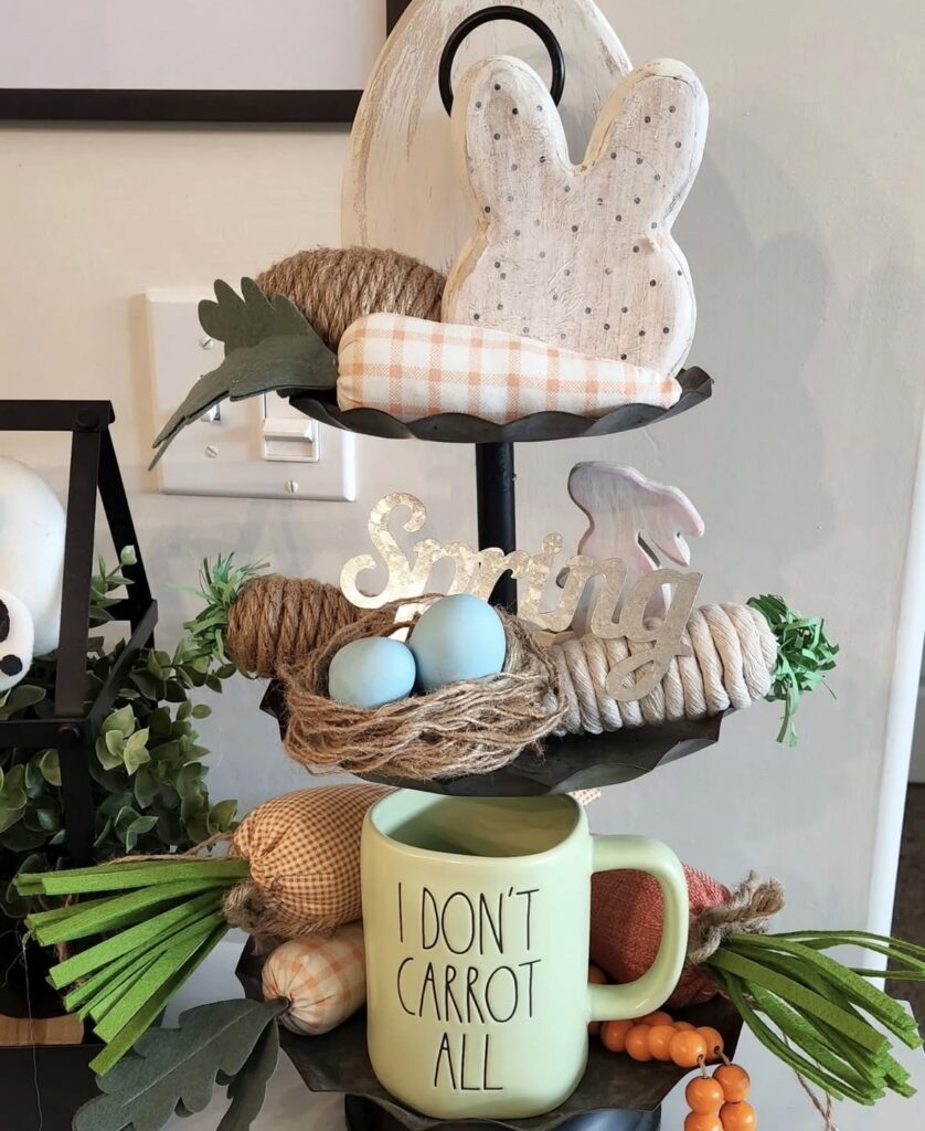 Neutral Easter tiered tray with wooden bunny cutout, blue eggs, rope accents, carrot themed mug, and soft spring farmhouse decor.