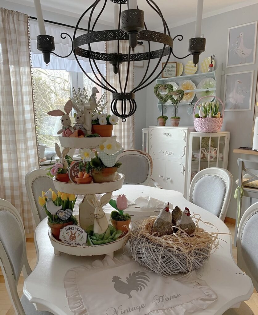 Neutral Easter tray decor with gold bunny figurines, white plates, coffee mugs, linen napkins, and soft farmhouse spring styling.