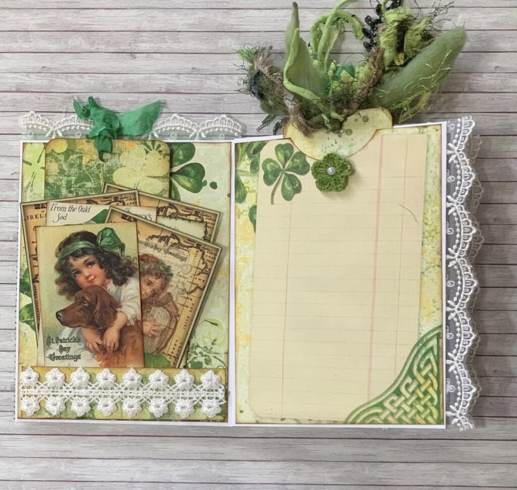 Open St. Patrick’s Day mini album spread with shamrock papers, a vintage girl-and-dog journaling card pocket, and a lined writing page.