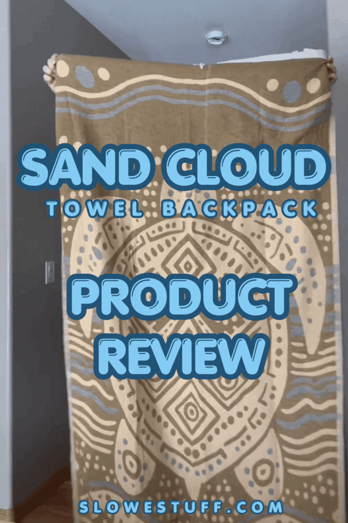 Pinterest graphic showing sand cloud towel backpack being held up with heading Sand Cloud Towel Backpack Product Review