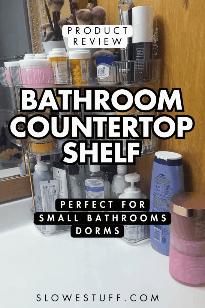 Pinterest pin graphic showing a clear three-tier bathroom countertop shelf with skincare, toiletries, and beauty products, with text that reads “Product Review,” “Bathroom Countertop Shelf,” and “Perfect for Small Bathrooms and Dorms,” featured by slowestuff.com.