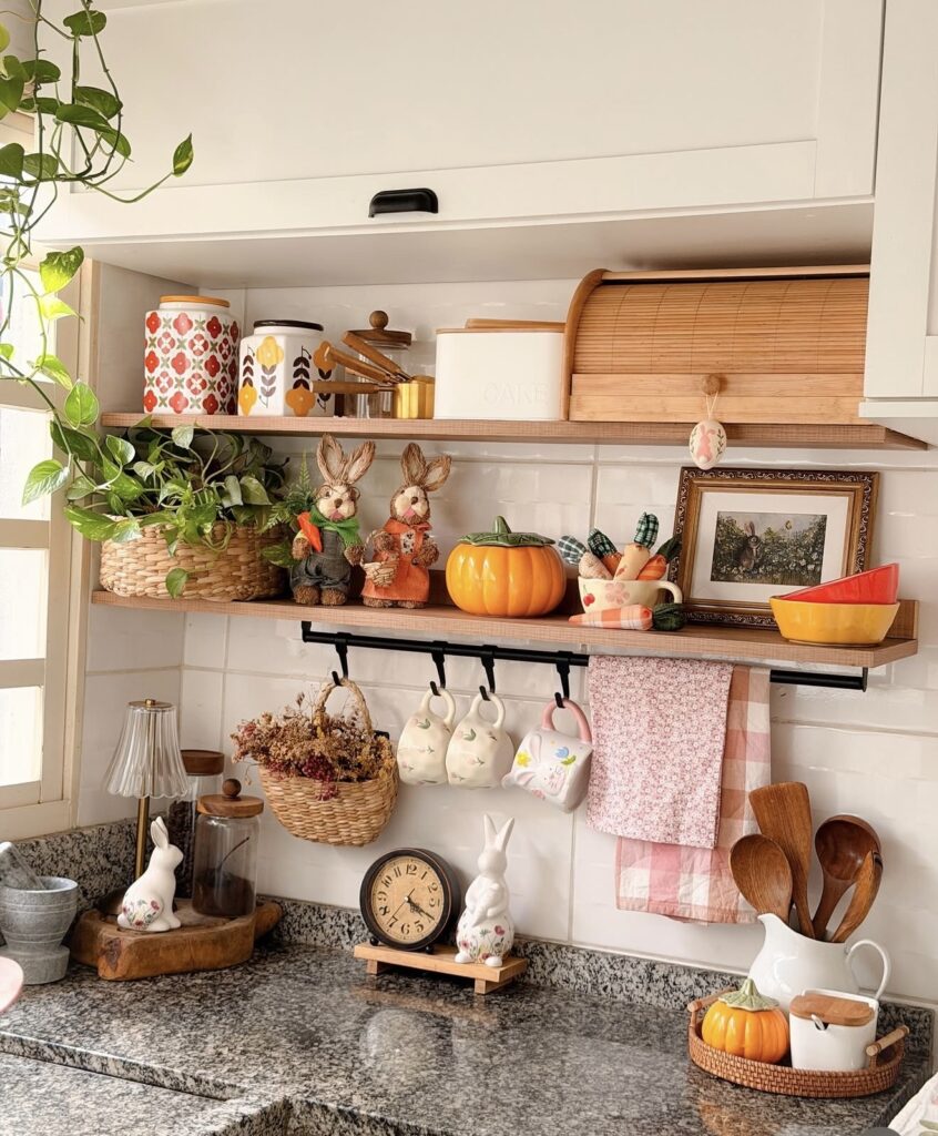 Neutral Easter hutch decor with white pitchers, bunny figurines, brass candlesticks, tulips, woven baskets, and green patterned plates.