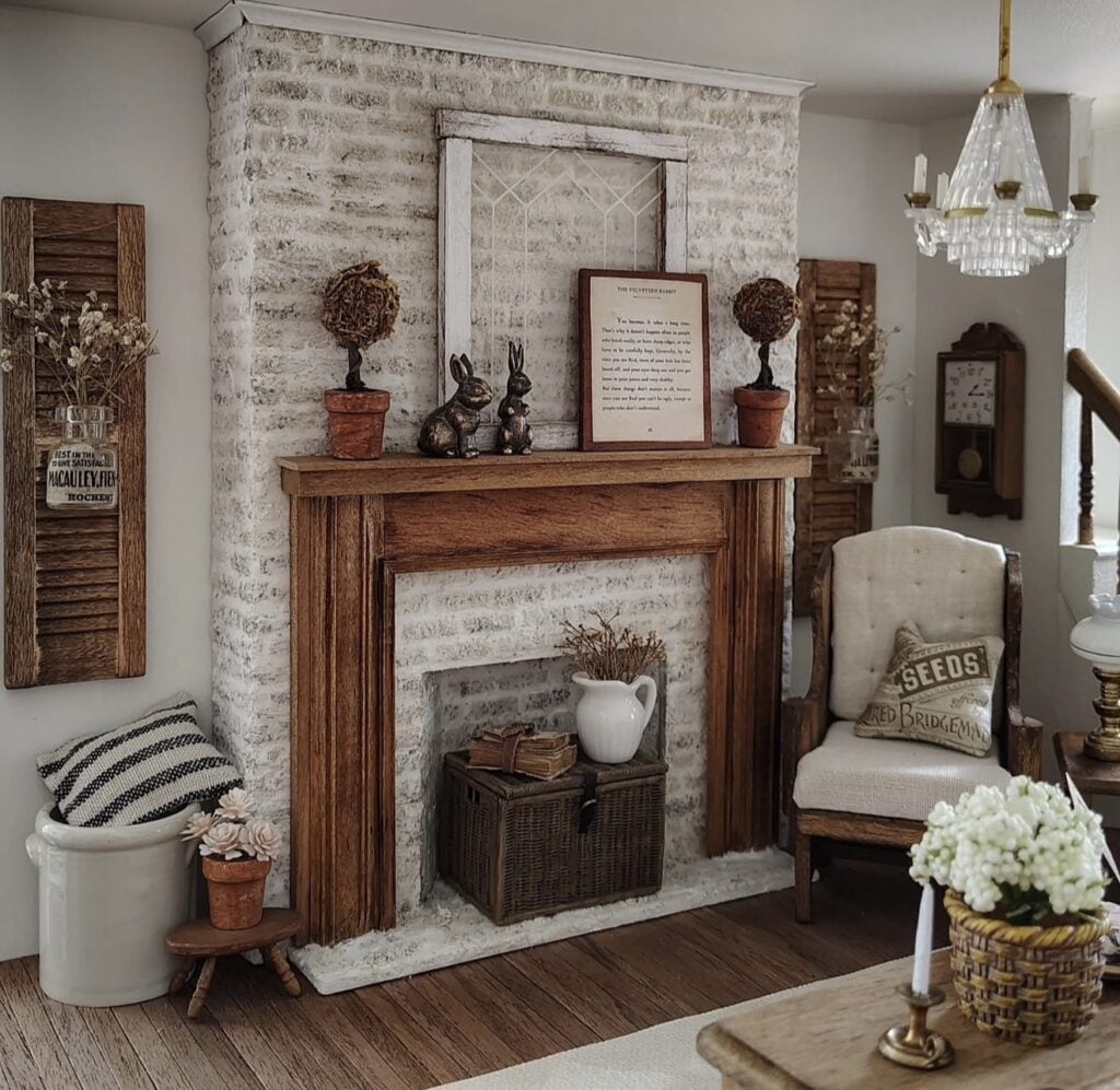 Charming Easter mantel decor with bunny artwork, neutral speckled eggs, soft greenery, and cottage-style spring accents.
