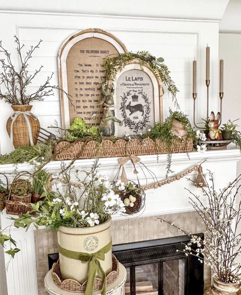 Neutral  Easter mantel decor with cabbageware, trailing greenery, rustic bunny accents, and natural spring styling on a warm neutral fireplace.