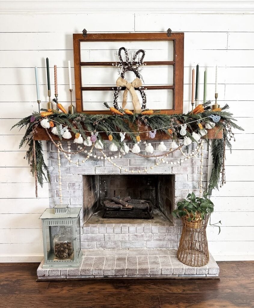 Easter mantel decor in a cozy living room with bunny figurines, greenery, and soft spring accents styled in a simple uncluttered way.