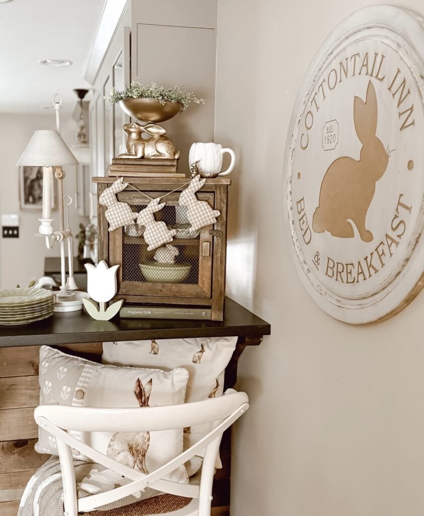 Coordinated Easter table decor with rabbit accents, flowers, candles, and a soft pastel color palette for spring entertaining.