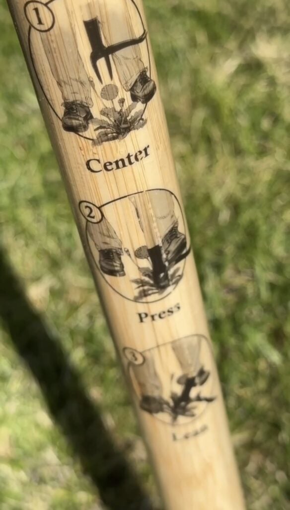 Handle of Grampa's Weeder showing instructions on how to use it