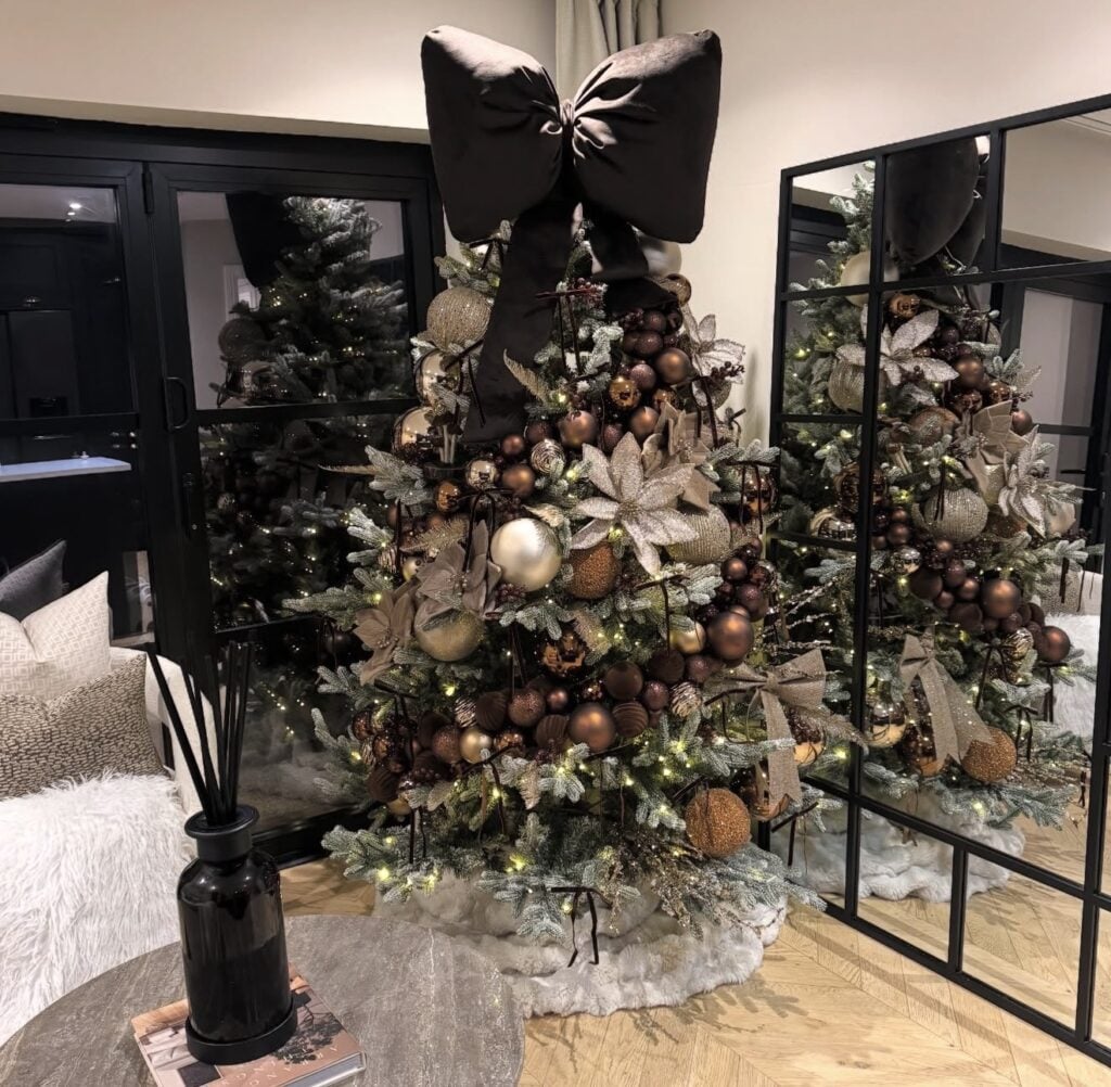 Chocolate brown Christmas tree with rich ornaments and elegant neutral holiday decor with big bow