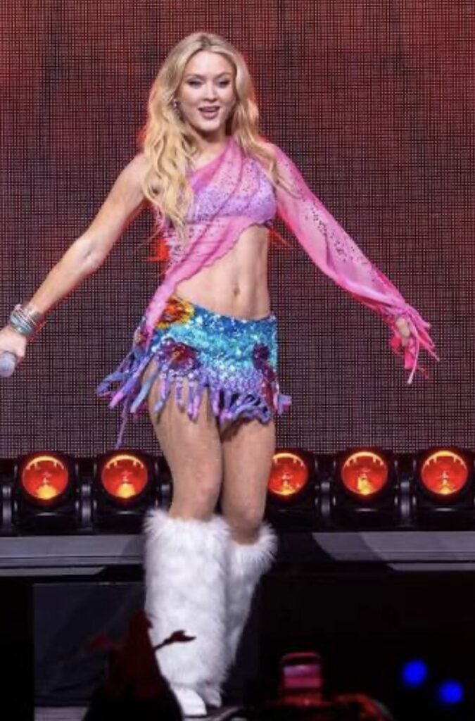 Zara Larsson in a bold colorful performance look that can be recreated as a Halloween costume.