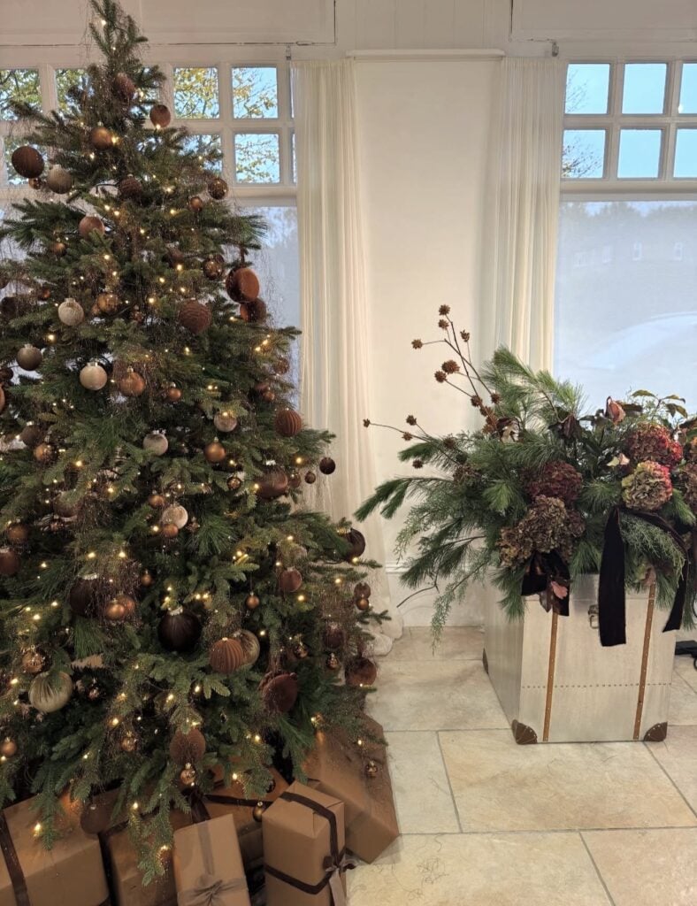 Stylish Christmas tree featuring warm brown decorations and rich natural holiday textures