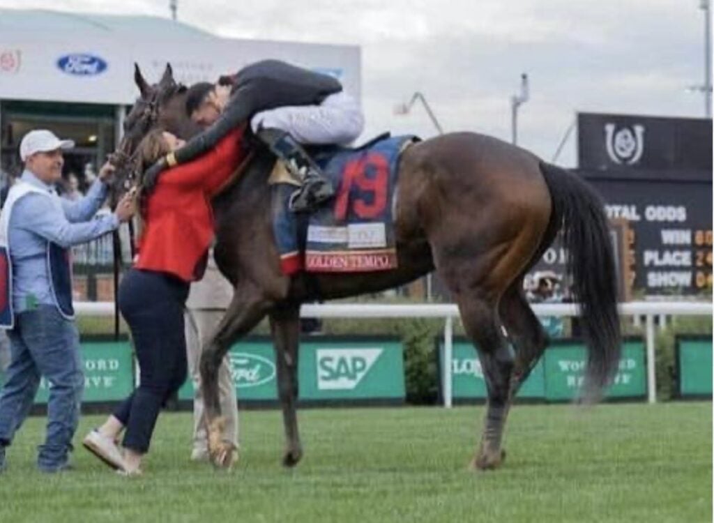 Trainer Cherie DeVaux celebrating with Kentucky Derby winner Golden Tempo and jockey José Ortiz.