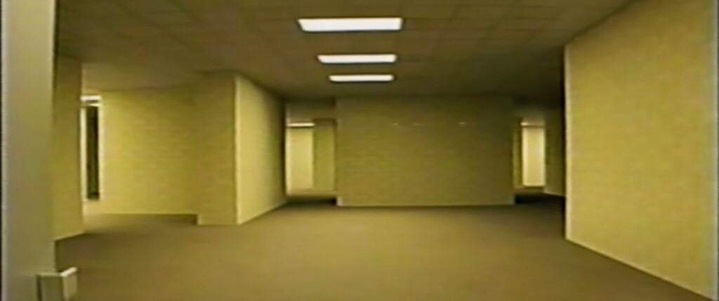 Yellow hallways and fluorescent lighting recreating The Backrooms as a creepy Halloween party theme.