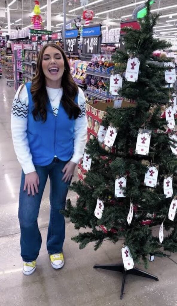 Angel Tree shopper Halloween costume with shopping bags, donation tags and holiday gifts.