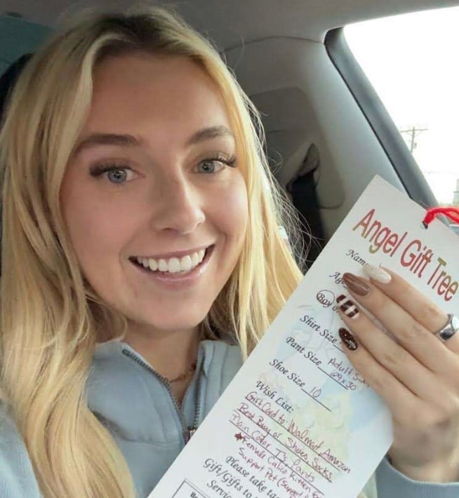 Angel Tree shopper with a shopping list and gifts, inspiration for a viral 2026 Halloween costume.