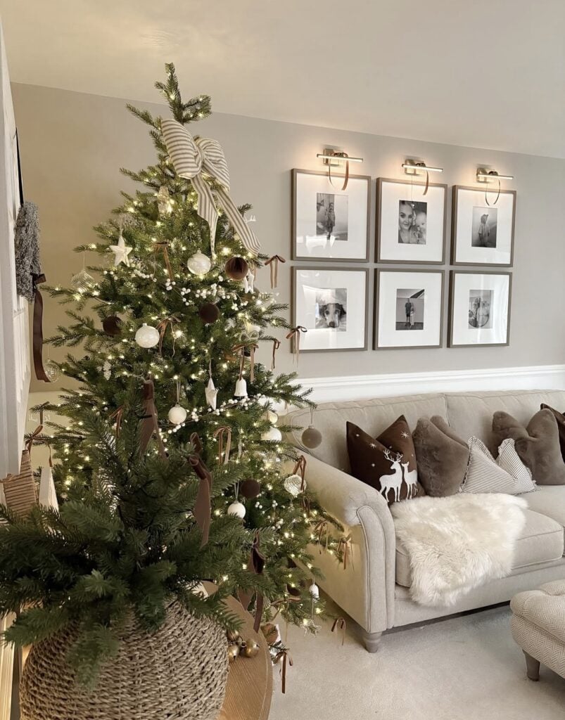 Natural brown Christmas tree with earthy ornaments, striped bow topper, organic textures, and warm holiday details