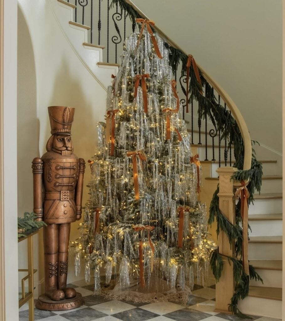 Unusual brown Christmas tree with creative decorations and distinctive neutral holiday styling with tinsel