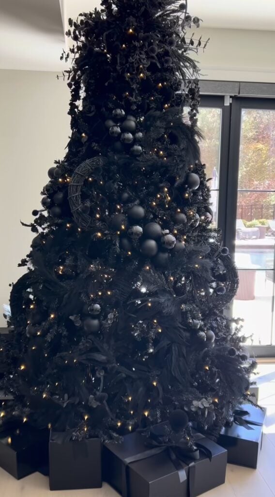 All-black Christmas tree with dark branches and monochromatic decorations for a striking modern Christmas look.
