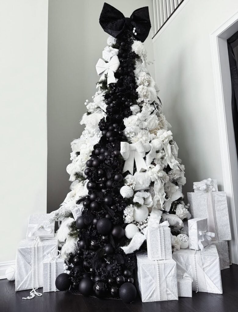 Black and white Christmas tree decorated with bold striped accents and graphic monochrome ornaments.