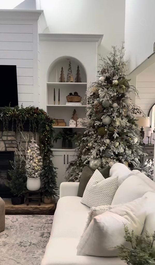Neutral Christmas tree in cream, brown, and soft gold tones with rustic holiday accents and warm white lights.
