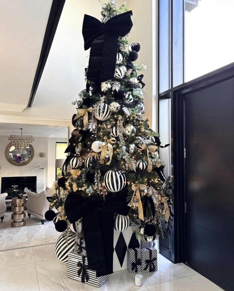 Christmas tree decorated with black and white ornaments and contrasting monochrome accents for an elegant holiday display.