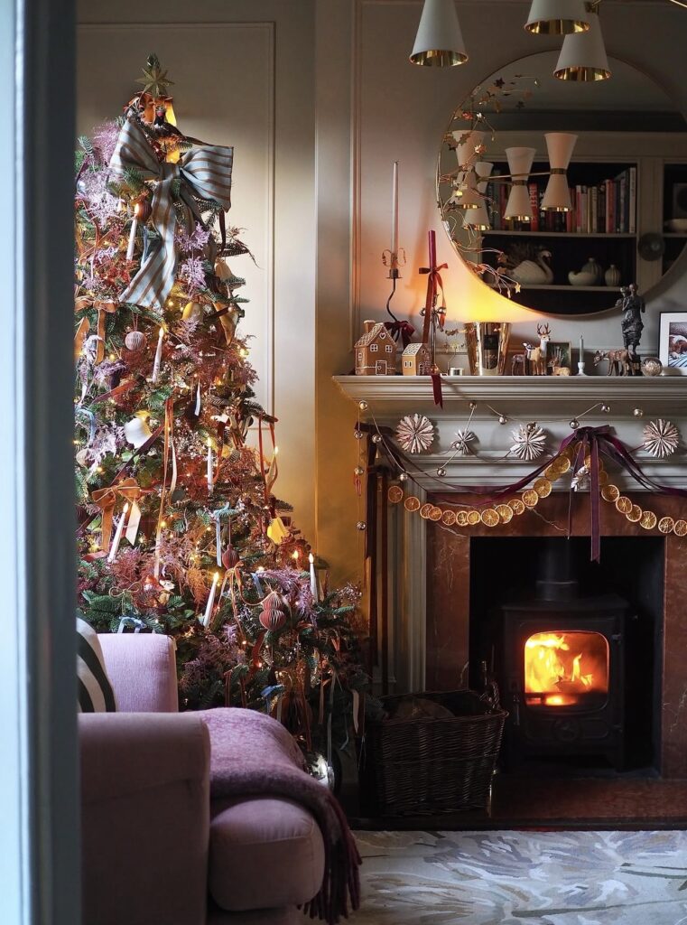 Vintage-inspired floral Christmas tree decorated with flowers, nostalgic ornaments, greenery, and warm holiday lighting.