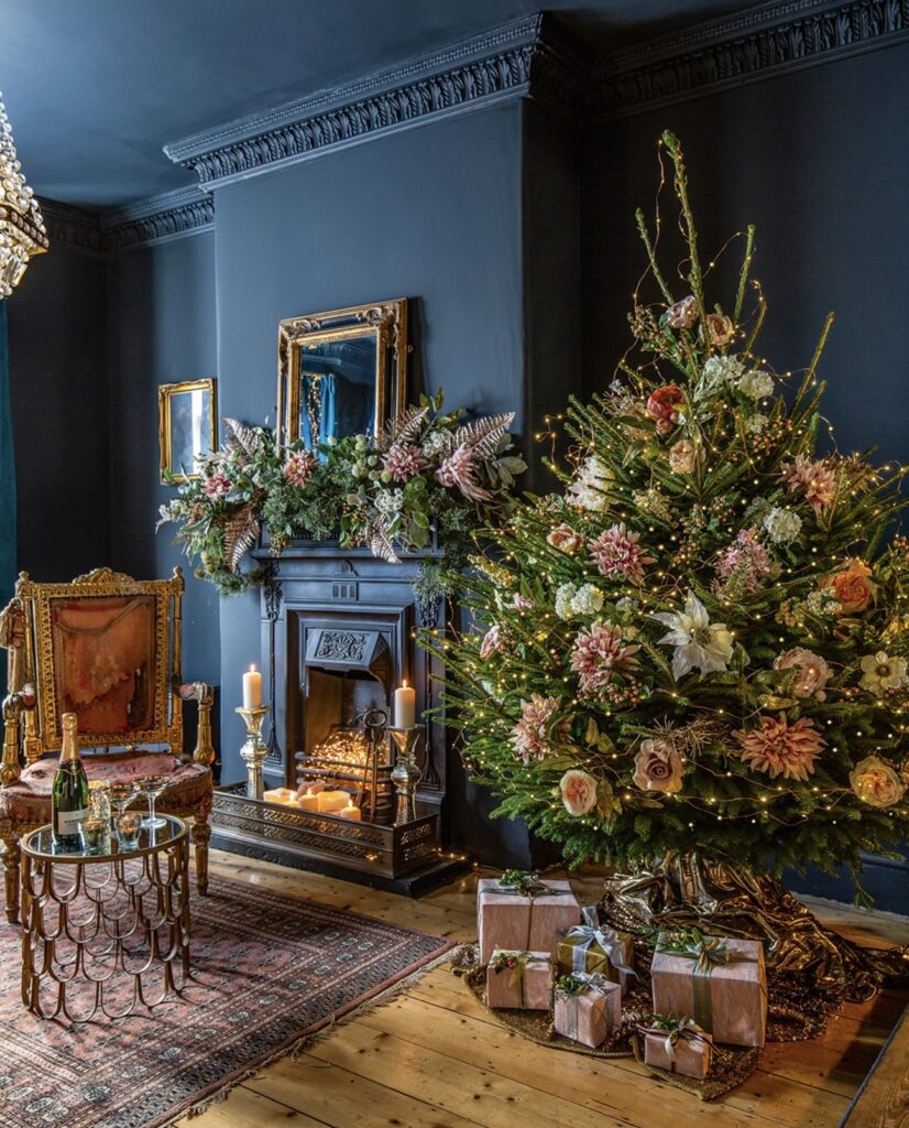 Natural floral Christmas tree decorated with flowers, branches, greenery, and organic botanical accents.