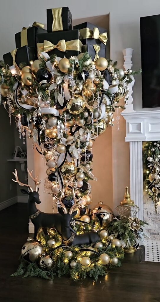 Upside-down Christmas tree decorated in black and white with dramatic monochrome ornaments and holiday accents.