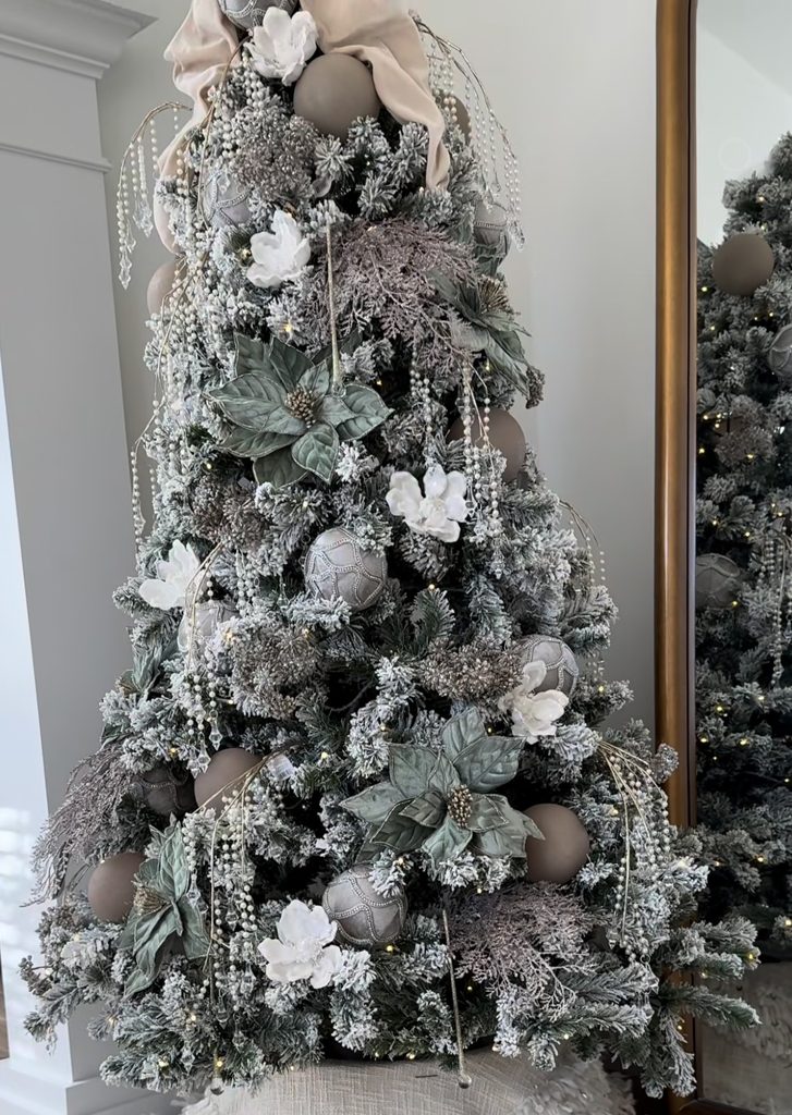 Bold neutral Christmas tree proving neutral is not boring with layered textures, metallic ornaments, ribbon, and natural colors.