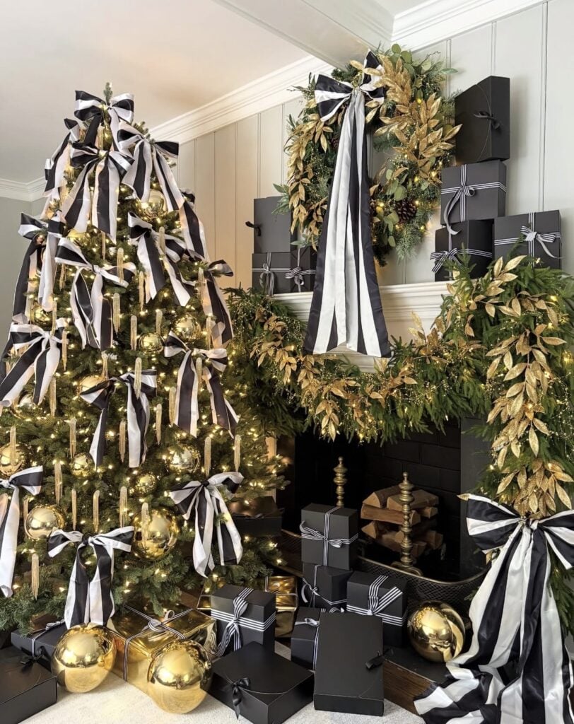 Christmas tree decorated with black and white ribbon woven through the branches with coordinating monochrome ornaments.