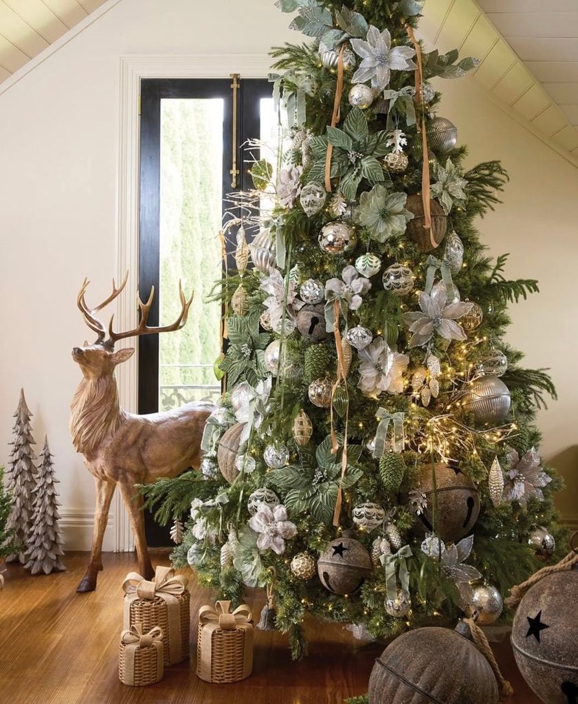 Neutral Christmas tree decor featuring warm beige, cream, gold, and natural accents layered throughout the branches.