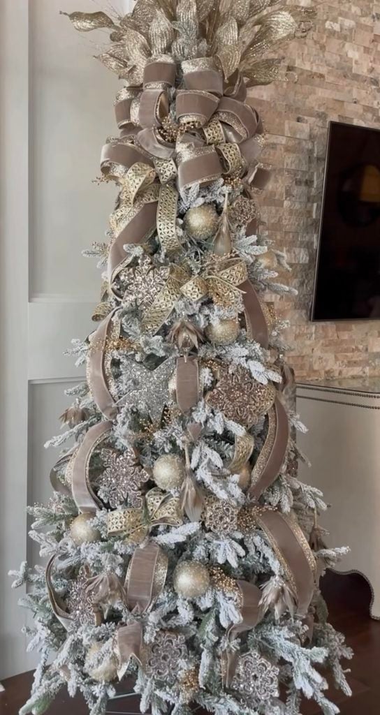 Neutral-on-neutral Christmas tree design featuring layered cream, beige, champagne, and natural textures.