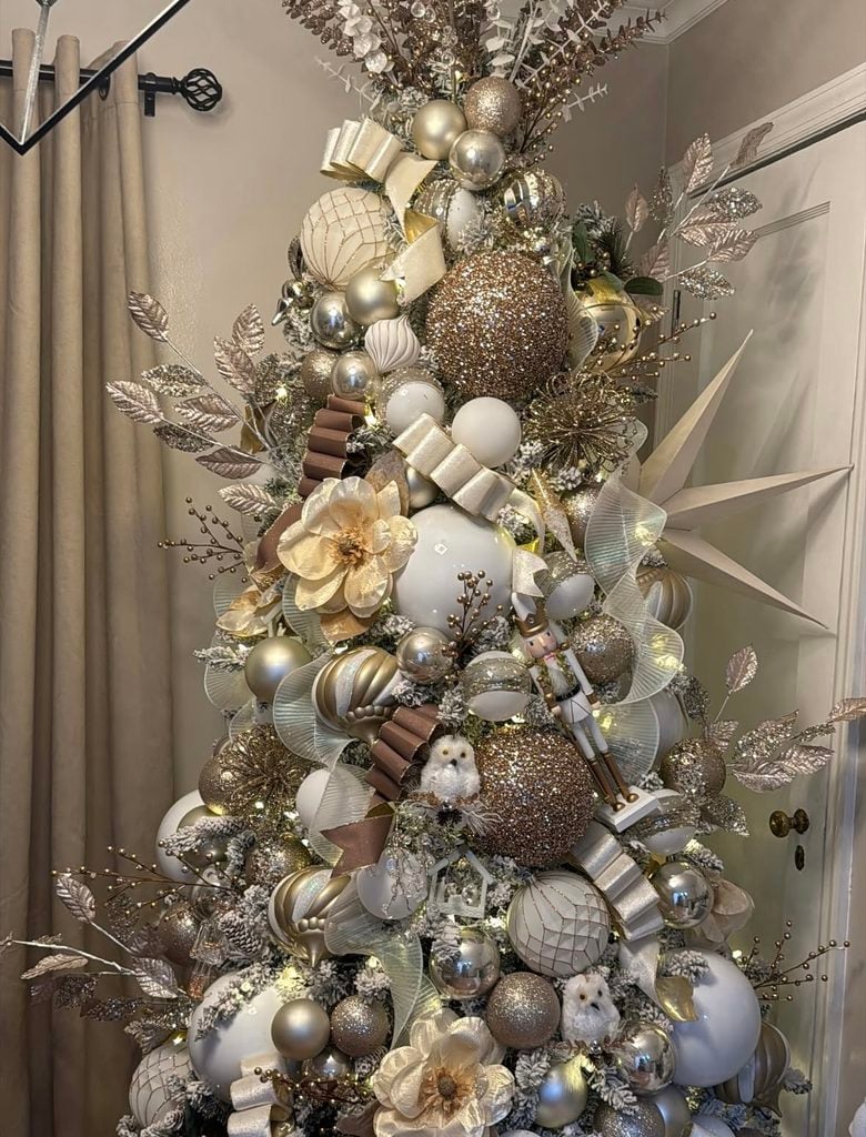 Unexpected neutral Christmas tree styling with layered earthy colors, metallic accents, and creative holiday decorations.
