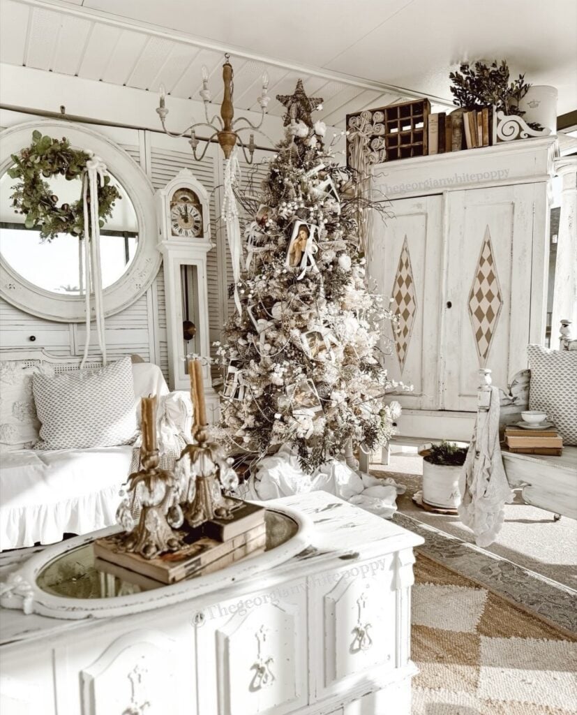 Victorian-inspired Christmas tree decorated in white with romantic ornaments, elegant ribbon, vintage details, and softly glowing lights.