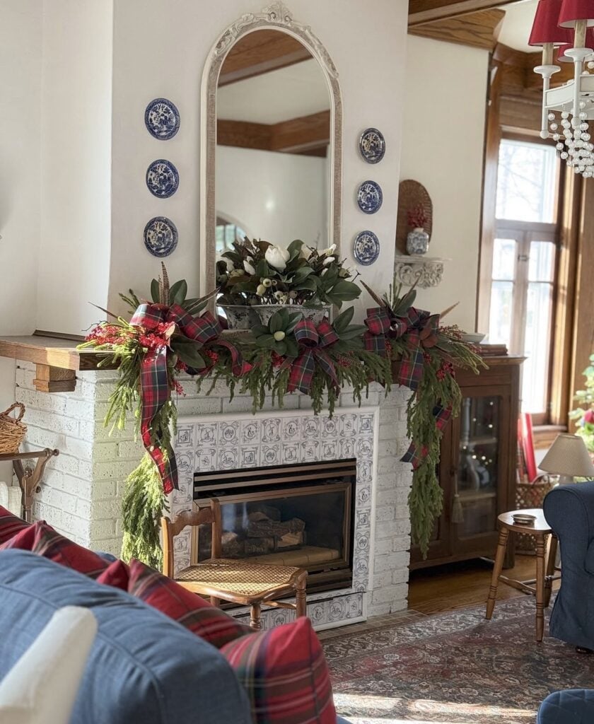 Ralph Lauren Christmas mantel inspiration with layered greenery, classic colors, and polished holiday decor with blue porcelain pieces