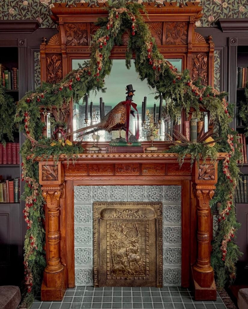 Hunt club inspired Christmas mantel with a pheasant accent, greenery, and classic Ralph Lauren holiday styling.