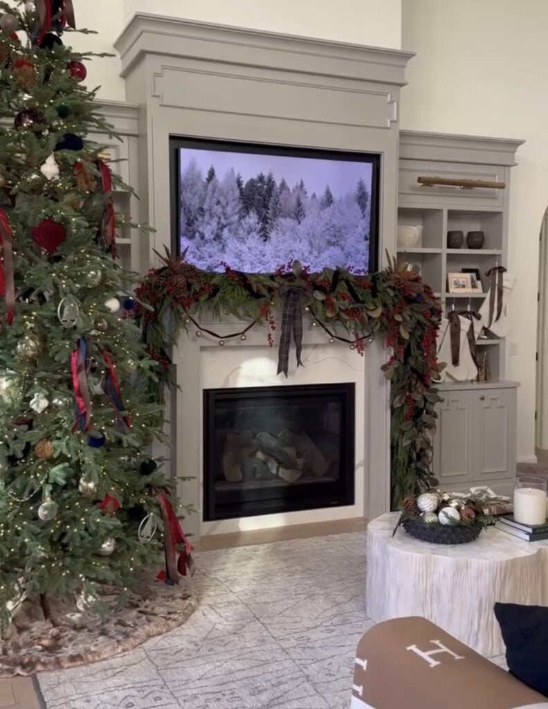 Elegant Christmas fireplace mantel with classic greenery and refined holiday decor.